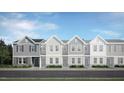 Modern three-unit townhome community with gray and white exterior at 1241 Willow Tree Way # 161, Graham, NC 27253