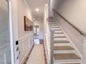 Modern staircase with gray railing and hardwood steps at 205 Pond Vw Ct # 2, Fuquay Varina, NC 27526