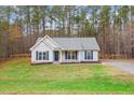 Ranch style house with blue shutters and yard at 2504 Patton Lane Ln, Franklinton, NC 27525