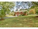 Brick home with attached two-car garage and large backyard at 304 Homestead Rd. Rd, Chapel Hill, NC 27516