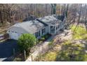 Grey home with attached two-car garage and covered front porch at 713 Cooke Rd, Louisburg, NC 27549