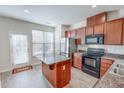 Bright kitchen with stainless steel appliances and access to the backyard at 100 Stratford Lakes Dr # 318, Durham, NC 27713