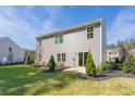 Spacious backyard with a patio and lush green lawn at 214 Leven Dr, Gibsonville, NC 27249