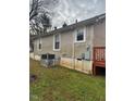 Side view of a single-story home with an outdoor AC unit at 910 Patton St, Graham, NC 27253