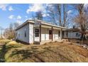 Front exterior of a charming home with covered porch and landscaped yard at 112 Edgewood Dr, Roxboro, NC 27573
