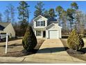 Two-story house with a driveway and landscaping at 2816 Smoke Pl, Raleigh, NC 27610