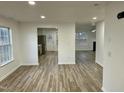 Open concept living and kitchen area with hardwood floors at 2816 Smoke Pl, Raleigh, NC 27610