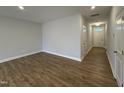 Bright foyer with light hardwood floors and neutral walls at 527 Eversden Dr, Zebulon, NC 27597