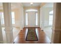 Elegant entryway with hardwood floors and columns at 10620 Silverwood Creek Dr, Raleigh, NC 27614