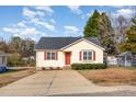 House exterior showcasing a yellow exterior and red door at 28 Park Place Street St, Angier, NC 27501