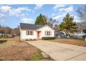 House exterior featuring a yellow front and a large yard at 28 Park Place Street St, Angier, NC 27501