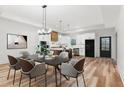 Modern farmhouse dining room with a large wooden table and stylish chairs at 4017 Mebane Oaks Rd, Mebane, NC 27302