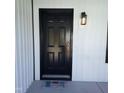 Modern black front door with a welcoming doormat at 4553 Dedication Dr, Raleigh, NC 27610