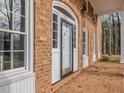 White front door, brick exterior, and a brick walkway at 191 Pine Lake Dr, Siler City, NC 27344