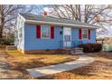 House exterior with blue siding, red shutters, and a walkway at 208 N Beaumont Ave, Burlington, NC 27217