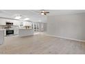 Modern kitchen with white cabinets, stainless steel appliances, and an island at 2950 Wildberry Ct, Mebane, NC 27302