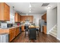 Spacious kitchen with wood cabinets, stainless steel appliances, and an island at 722 Blue Lake Dr, Mebane, NC 27302