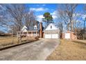 Two-story home with attached garage and storage shed at 101 Creekside Dr, Selma, NC 27576