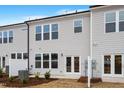 Private backyard with patio, landscaping, and AC unit at 1042 Westerland Way # 213, Durham, NC 27703