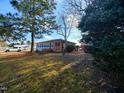 Ranch house with a large yard and mature trees at 1534 S Hollybrook Rd, Wendell, NC 27591