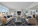 Spacious living room with fireplace, large windows, and comfortable seating at 235 Cottage Way, Pittsboro, NC 27312