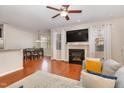 Open concept living area with hardwood floors, fireplace, and dining area at 2722 Evanston Ave, Durham, NC 27703