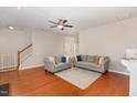 Bright living room features hardwood floors, neutral walls, and comfortable seating at 2722 Evanston Ave, Durham, NC 27703