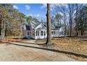 Side view of charming house with newly paved driveway at 309 Monterey Ct, Benson, NC 27504