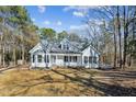 Newly renovated home with a large yard and wooden fence at 309 Monterey Ct, Benson, NC 27504