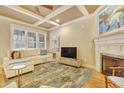 Light-filled living room, featuring hardwood floors and a fireplace at 3827 Sw Durham Dr, Durham, NC 27707