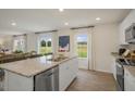 Spacious kitchen island with granite countertops and stainless steel appliances at 103 Reagan Crest Dr, Clayton, NC 27520