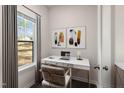 Bright home office with desk, chair and art at 499 Duncan Creek Rd # 143, Lillington, NC 27546