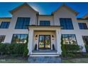 Stunning two-story home with a white brick facade and large windows at 1425 Sky Vista Way, Raleigh, NC 27613