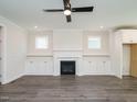 Spacious living room with fireplace, built-in shelving, and hardwood floors at 1809 Bright Lantern Way, Wendell, NC 27591