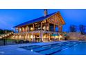 Community pool with a clubhouse and outdoor seating area at 2517 Lillian Woods Way, Wendell, NC 27591