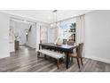 Dining area with hardwood floors and access to entryway at 601 Emerald Bay Cir, Raleigh, NC 27610