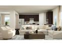 Spacious living room featuring a sectional sofa and dark brown cabinets at 612 Emerald Bay Cir, Raleigh, NC 27610