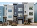 Modern three-story townhomes with attached garages and staircases at 612 Rocky Knob Ct, Raleigh, NC 27601