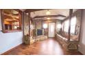 Inviting entryway with stone fireplace and wood floors at 1021 Water Plant Rd Rd, Zebulon, NC 27597