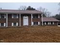 Brick ranch house with attached garage and large yard at 1815 Bethlehem Rd, Rocky Mount, NC 27803