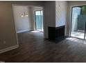 Living room features a fireplace and sliding glass doors to a patio at 4600 Millstone Dr # D, Raleigh, NC 27604