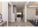 Bright entryway with hardwood floors, leading to the living room and staircase at 104 Newport Landing Lndg # 100, Garner, NC 27529