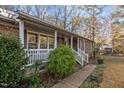 Ranch house with porch and walkway, surrounded by greenery at 112 Collums Rd, Chapel Hill, NC 27514