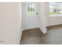Light and airy entryway with wood-look floors and a glass-paneled door at 1129 Middlecrest Dr, Rocky Mount, NC 27804