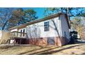 House back elevation with deck and partial view of house at 1313 First Pointe, Sanford, NC 27332