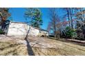 House back elevation with deck and wooded area at 1313 First Pointe, Sanford, NC 27332