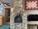 Large stone fireplace with arched opening at 144G Celebrity Dairy Way, Siler City, NC 27344