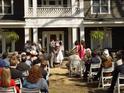 Wedding ceremony taking place on the lawn at 144G Celebrity Dairy Way, Siler City, NC 27344