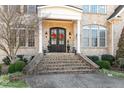 Elegant front entry with double doors and brick staircase at 193 N Grande Overlook Dr, Clayton, NC 27527