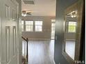 Bright entryway with mirror and view into living room at 112 Ryder Cup Cir, Raleigh, NC 27603
